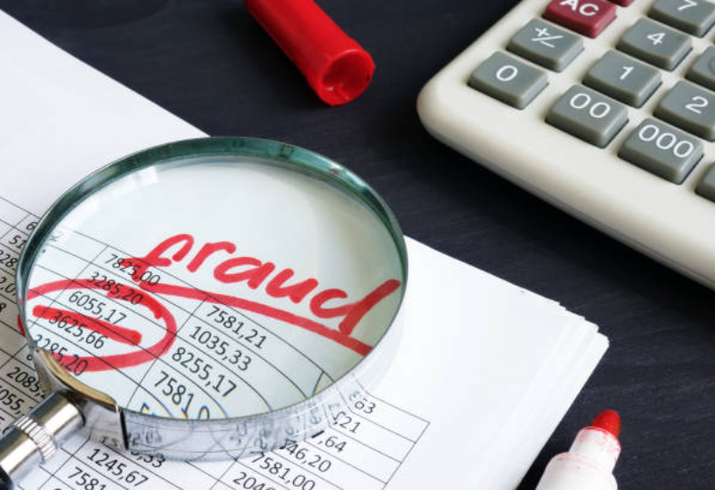 A photo detailing a sheet that says "fraud".