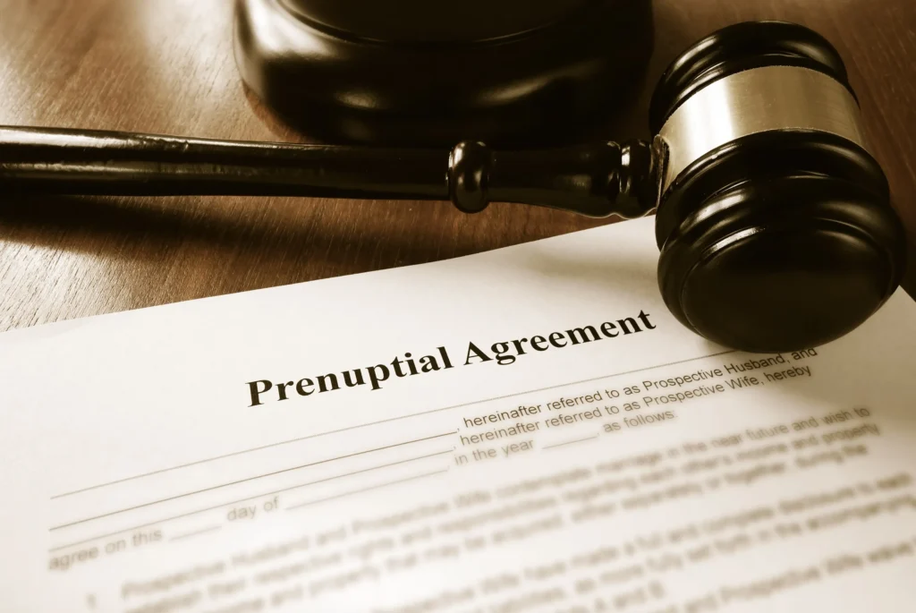 A paper titled "Prenuptial Agreement" with a gavel.