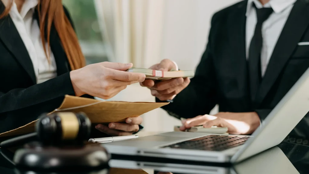 Business workers exchanging stolen money.