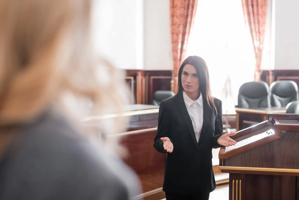 An attorney speaking to someone in court.