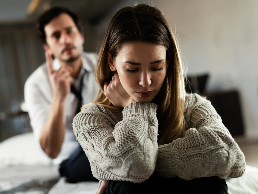 A woman being yelled at by a man.